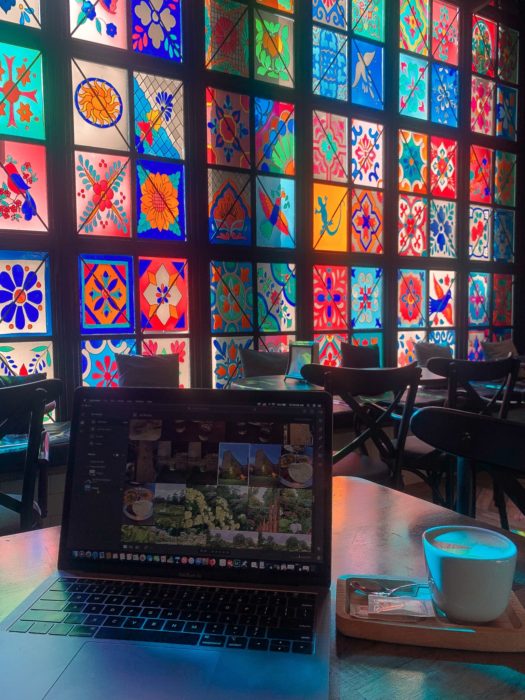 laptop, coffee, stained glass windows, chairs, table, coffee mug, build a house sitting profile
