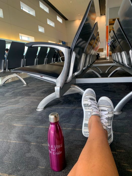 water bottle, shoes, legs, airport, chairs, house sitting etiquette