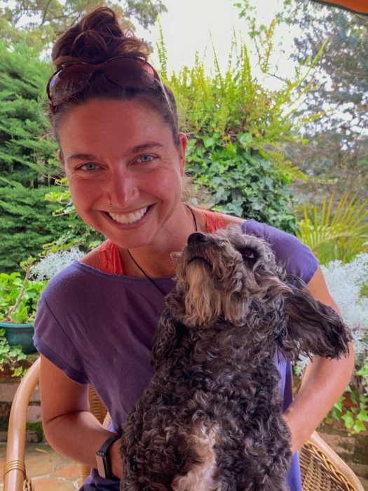 woman, smiling, dog, trees, chair, plants, house sitting