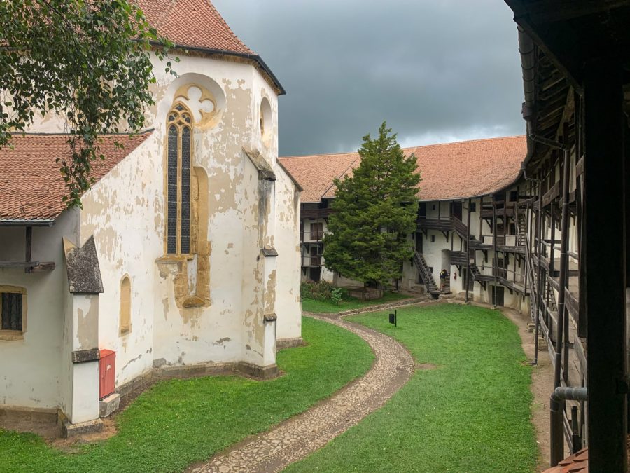 fortified church of Transylvania, Prejmer fortified church, church, fortress, day trips from Brasov, Transylvania, cloudy sky, tree, grass, path