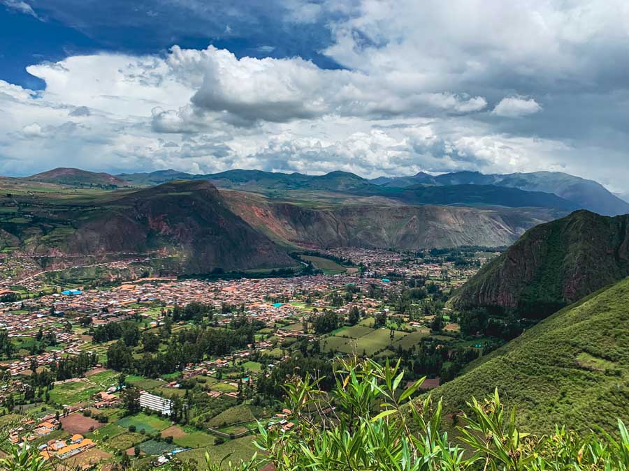 Urubamba Peru, sacred valley peru, urubamba village, saywa mountain hike, houses, village, grass, rainy season in peru