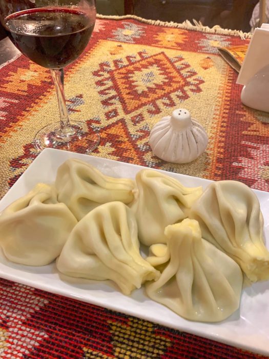 Khinkali House Kalakuri, Khinkali, table cloth, salt shaker, wine, wine glass, where to eat in Batumi