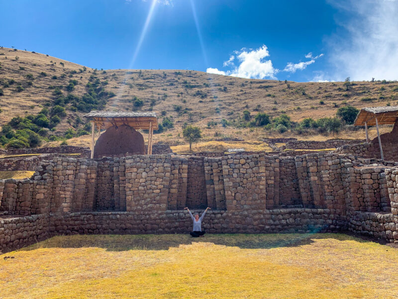 Mawk'allaqta, Maukallaqta, triple hinged Inca doors, stone, woman, mountain, cloud, sky, grass, Maukallacta Archaeological Park, unique landmarks in peru