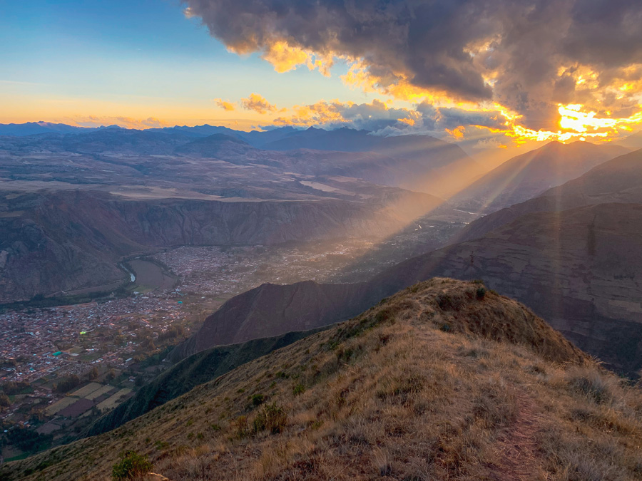 Saywa Mountain, Urubamba, sunset, mountains, clouds, sky, sunset, grass, ray of light, Sacred Valley hikes, things to do in the Sacred Valley in Peru, Peru's Sacred Valley, charming villages of South America, Sacred Valley Cusco