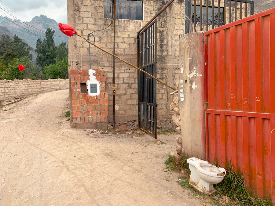 red flags in the Sacred Valley, chicharia, house, mountains, roads, things to do in Sacred Valley Peru, Sacred Valley Cusco, toilet