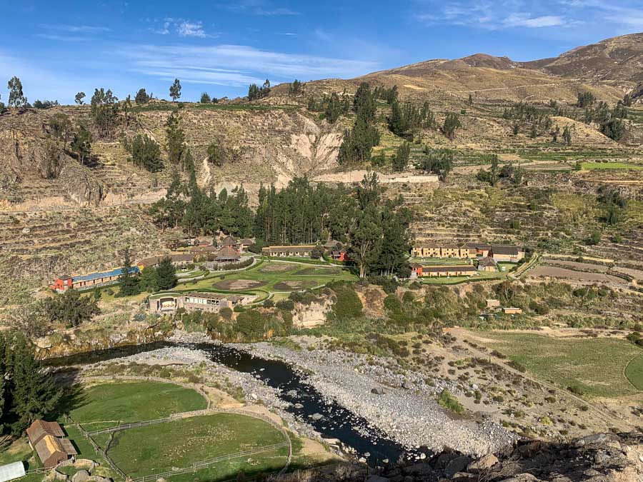 Colca Lodge Spa and Hot Springs, where to sleep in Colca Canyon, places to stay in Yanque Peru, Colca Canyon Peru hot springs, hot springs in Peru, Colca River, buildings, hotel, mountains, trees, hotels in Yanque Peru