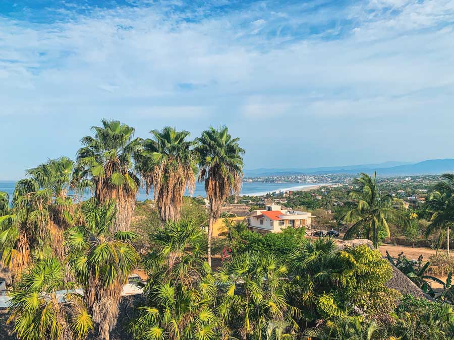 Puerto Escondido viewpoint, palm trees, buildings, best places to visit in Oaxaca state, mountains, sky