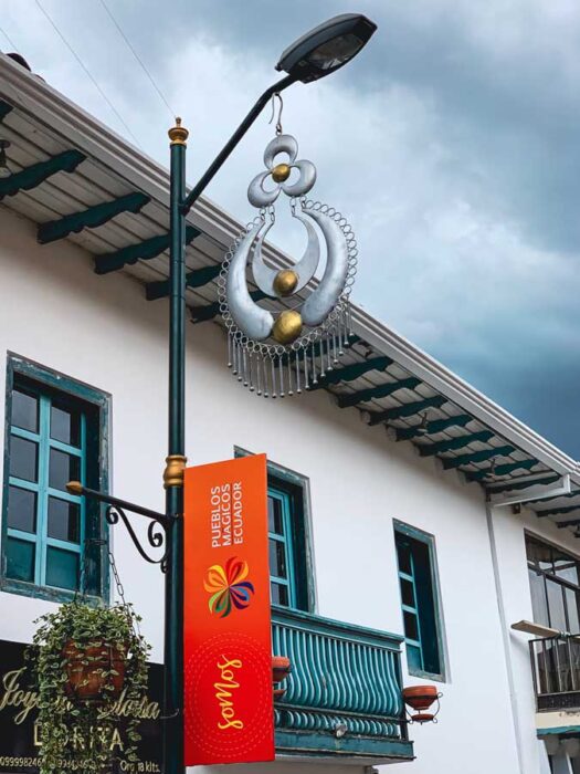Chordeleg Ecuador, artisan Ecuador villages, street lamp, earring, sky, house, plant, Cuenca day trips
