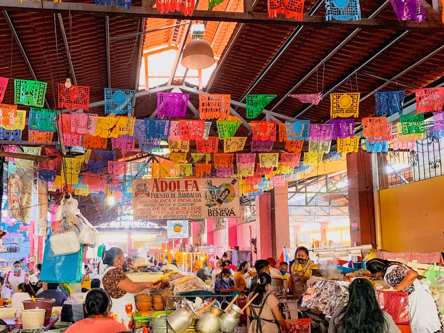 Barbacoa in Market Tlacolula, flags, people, Valley of Oaxaca, Sunday Market in Oaxaca