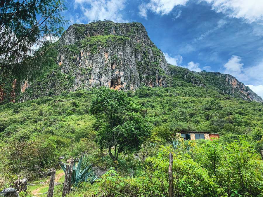 Devil's Cave, mountain, santiago apoala, hiking in oaxaca, building, trees, grass, plants, best places to visit in oaxaca state