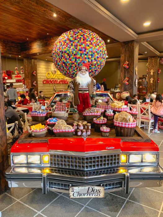 Chocolateria Dos Chorreras, car, santa, colorful disco ball, basket, table, Cuenca restaurants