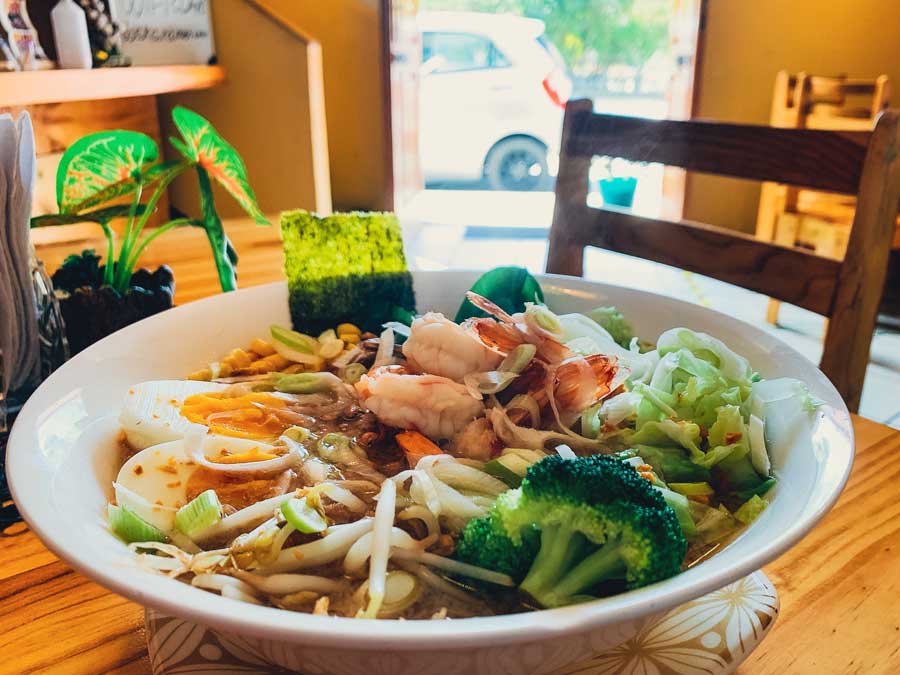 Osaka Ramen, Cuenca restaurants, bowl, ramen in Ecuador, table, plant, door, where to eat in Cuenca Ecuador