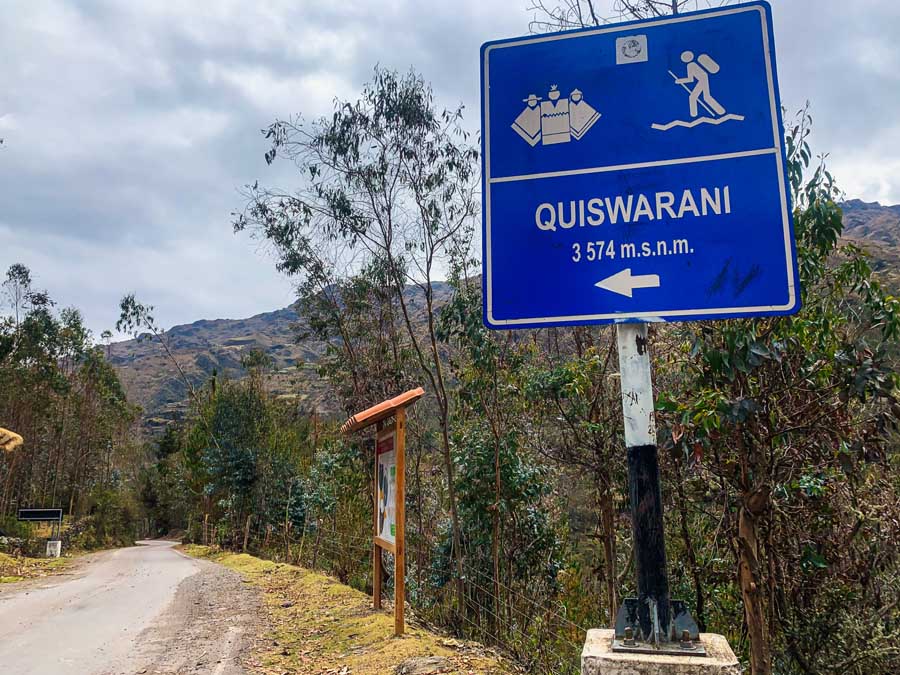 Quiswwarani Signboard, road, Lares Valley, one day lares hike, trees, mountains