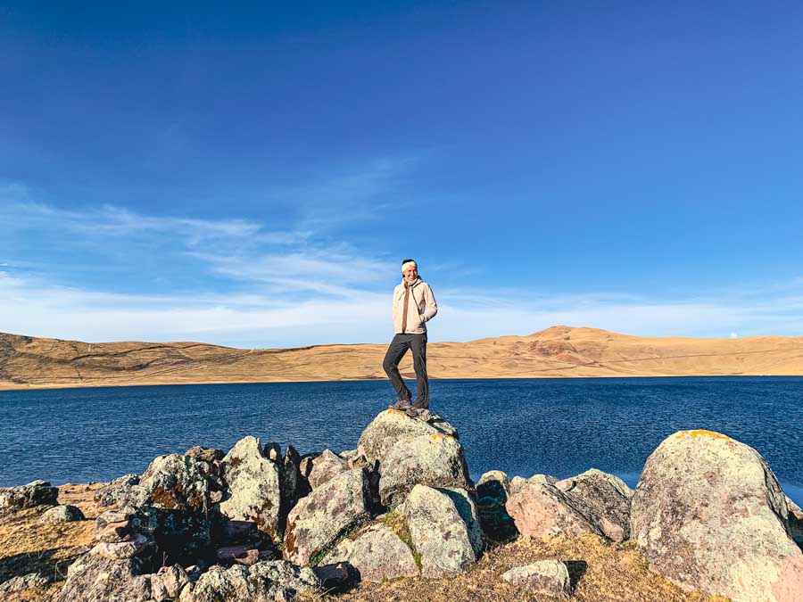 me posing in from of Laguna Qoricocha on the 2 day trek to Huchuy Qosqo