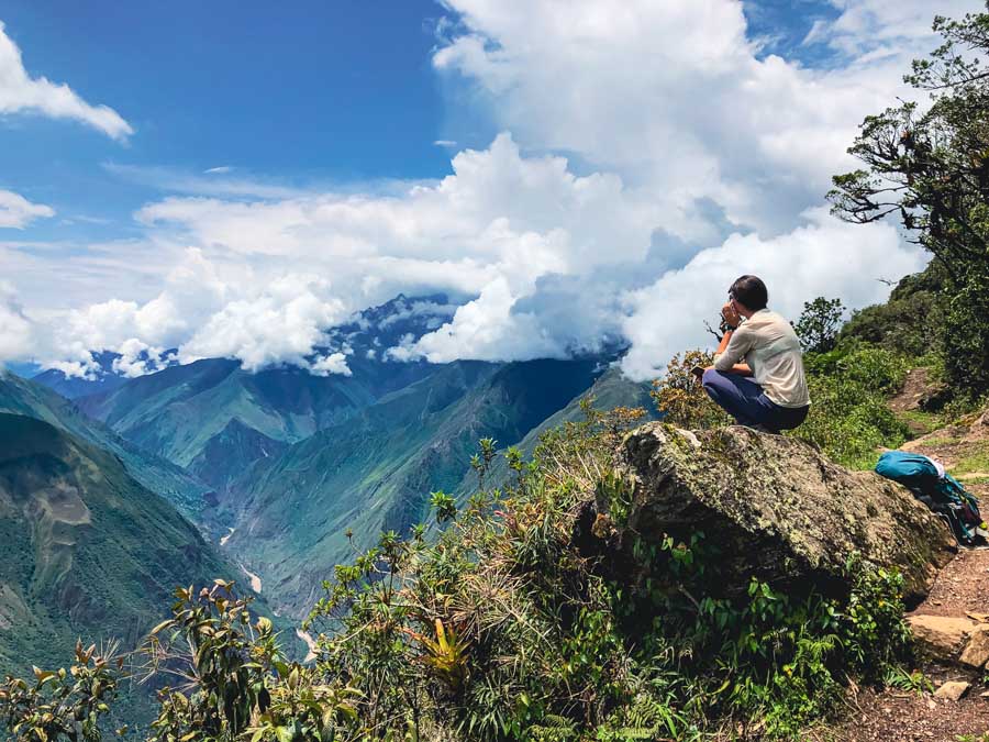 Me gazing out into the Andes Mountains on one of the best Cusco treks, Choquequirao