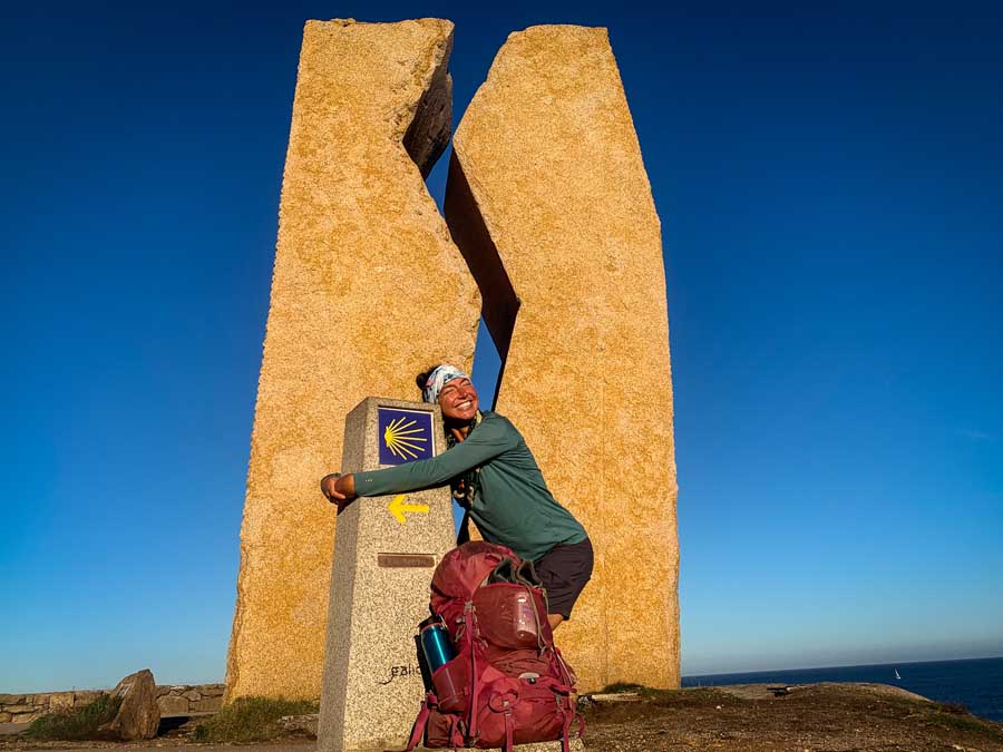Thankful for reaching the 0 KM marker in Muxia Spain with my Osprey Kyte 36 L bag