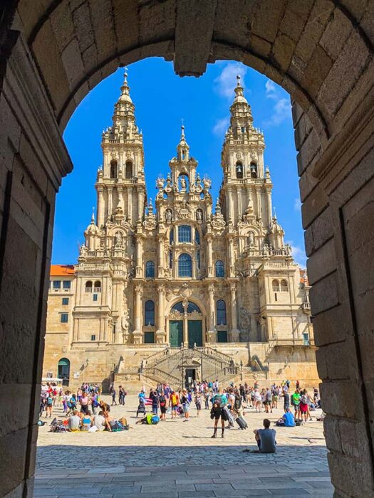 Pilgrims celebrate reaching the Cathedral de Santiago de Compostela 