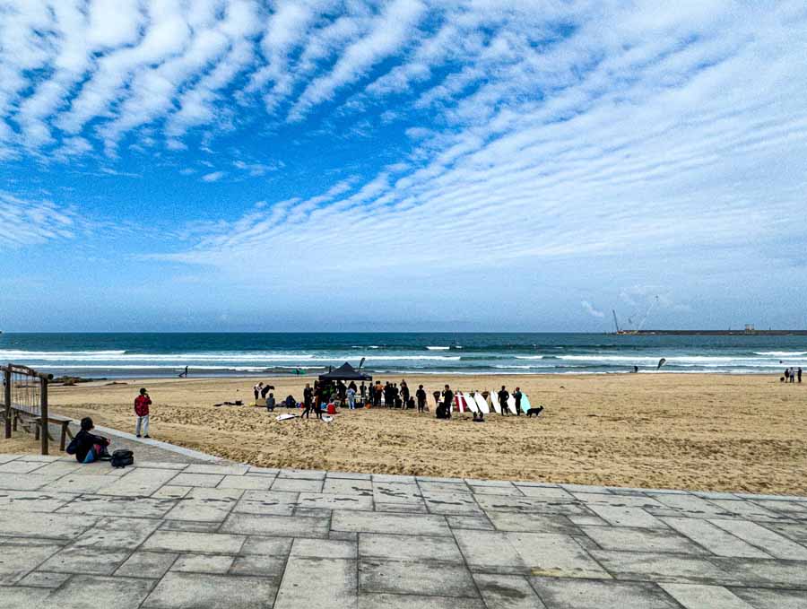 surfers taking a lesson on the sandy beach near Matosinhos Portugal