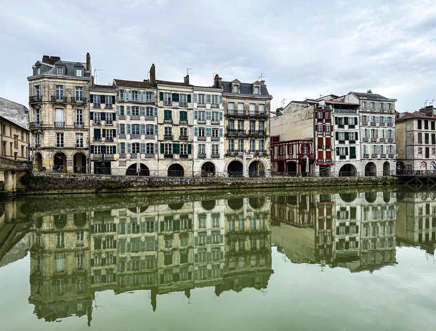 Bayonne wood houses reflect back on the Nive River