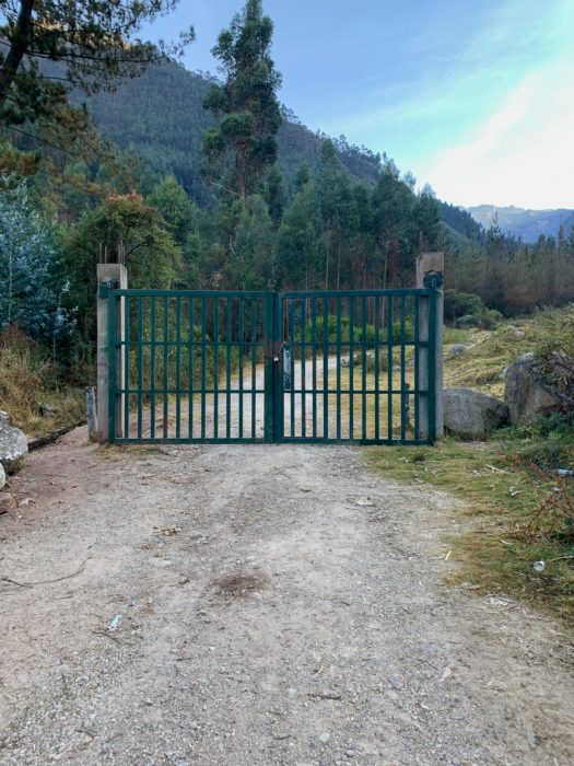 San Isidro, gate, road, trees, gravel road, clouds, sky, grass, trail to Laguna Juchuycocha